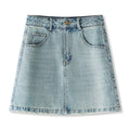 Women's high-waisted, washed blue denim mini skirt with rhinestone details and frayed edges; versatile and stylish.